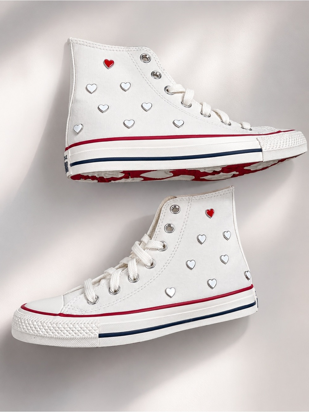 White High-Top Sneakers with Red and Navy Accents and Heart Studs